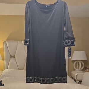 Tiana B. Elegant Black Dress with Embellished Cuffs